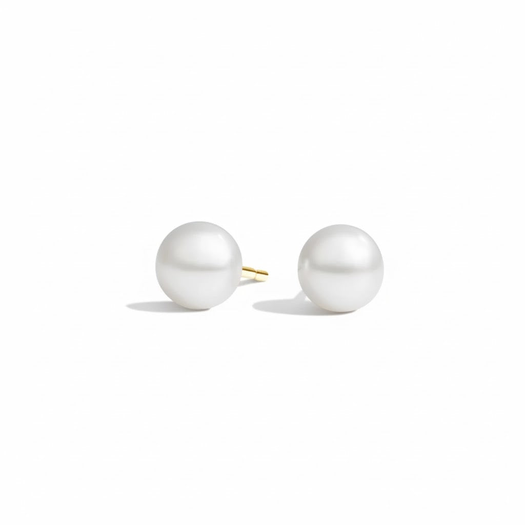 Pair of pearl earrings on a white background