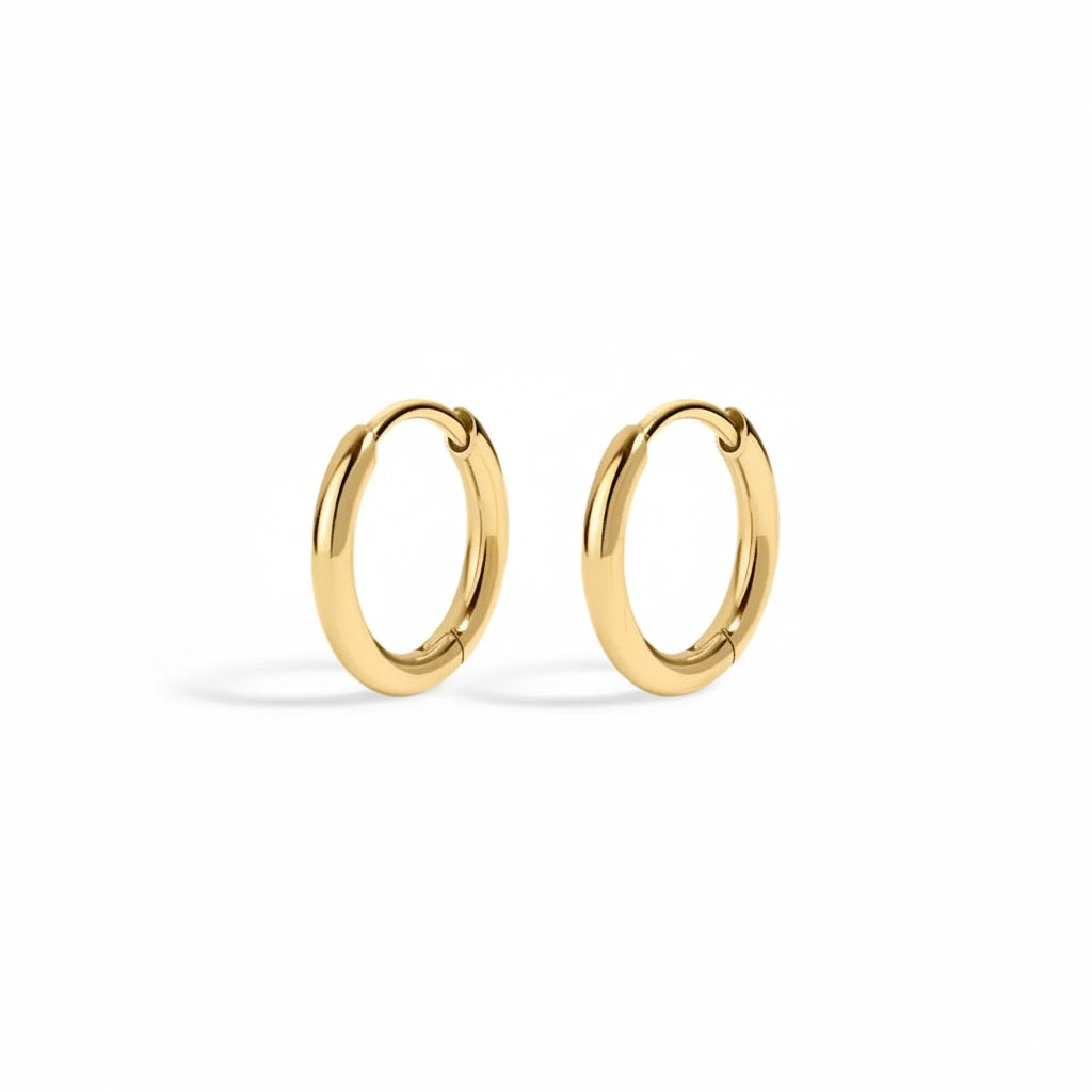 Gold hoop earrings on a white background