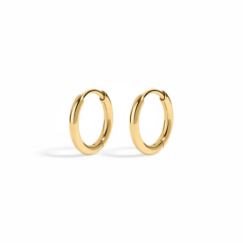Gold hoop earrings on a white background