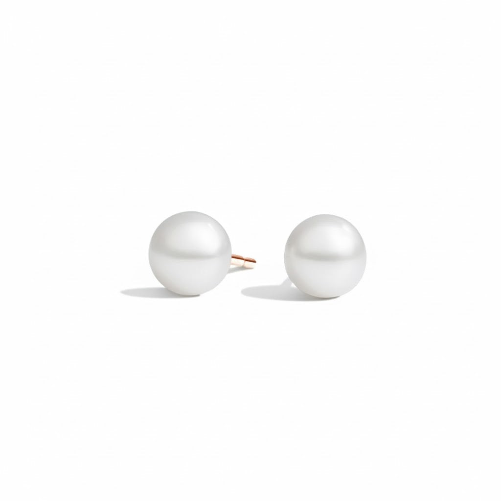 Pair of pearl earrings on a white background