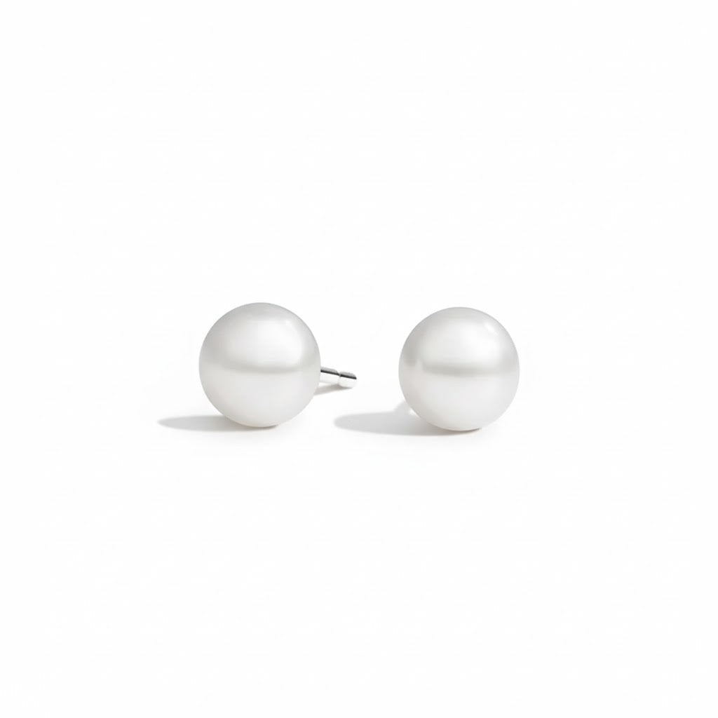 Pair of pearl earrings on a white background